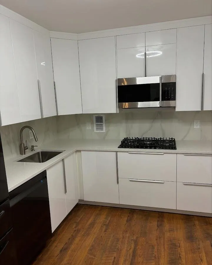 Restored kitchen with white cabinets after water damage in Olney